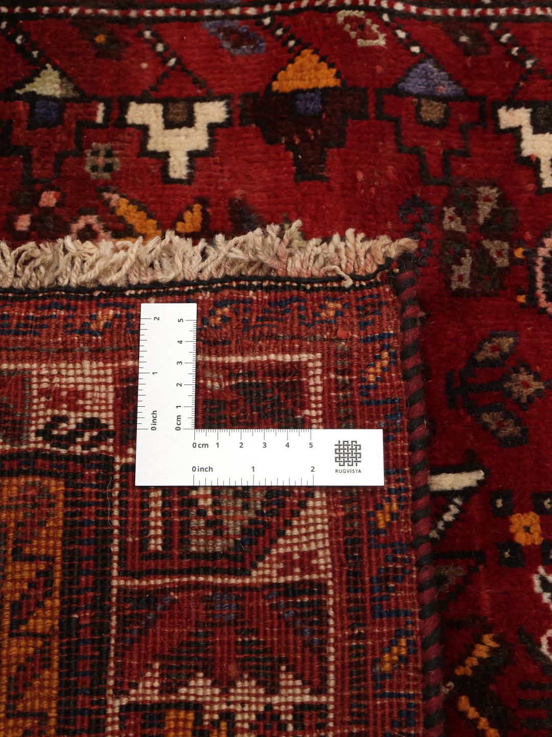 Hand-knotted Ghashghai Wool rug with geometric patterns in red and dark blue