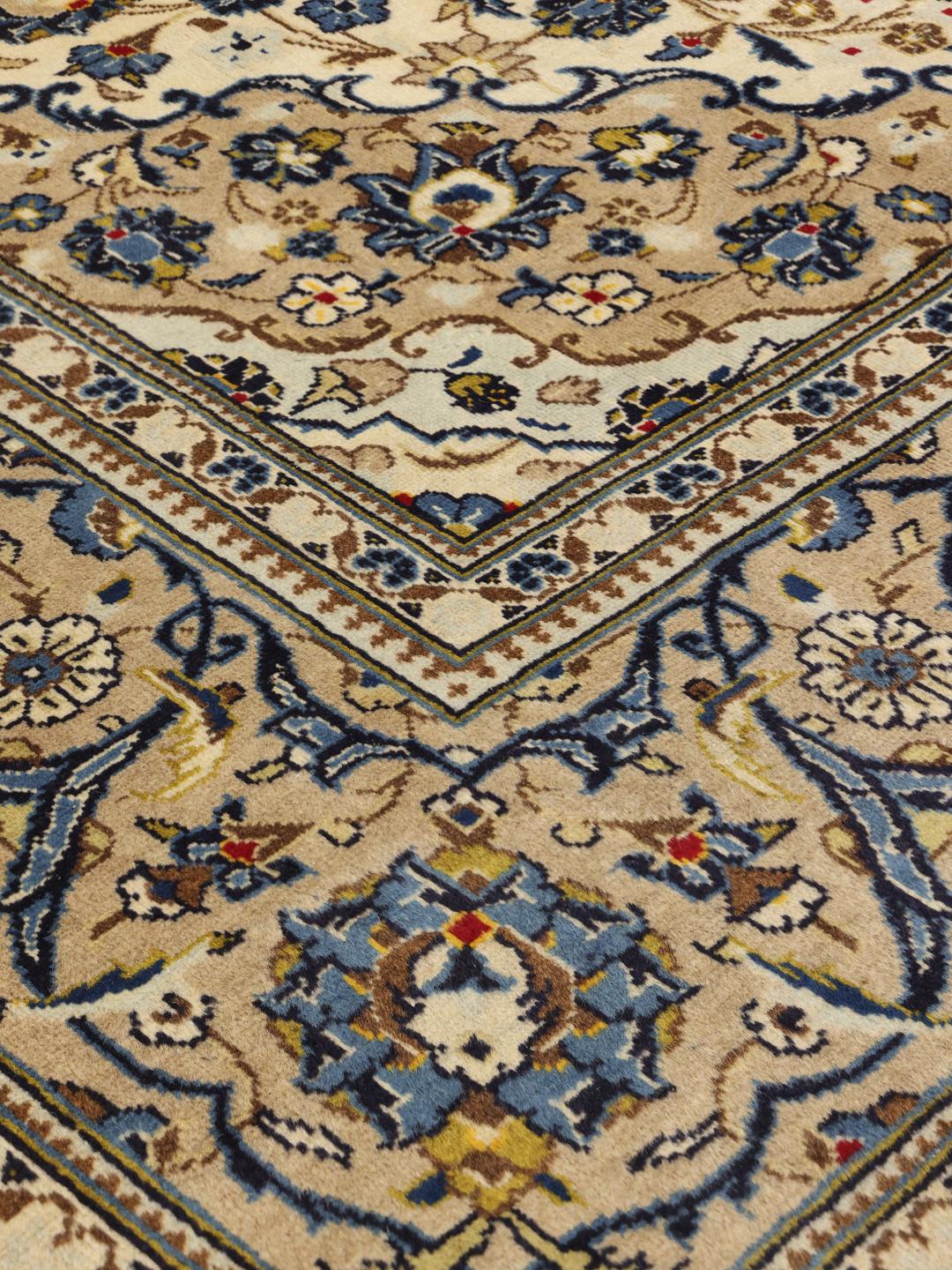 Hand-knotted Keshan rug from the Middle East with a beige and blue floral medallion pattern