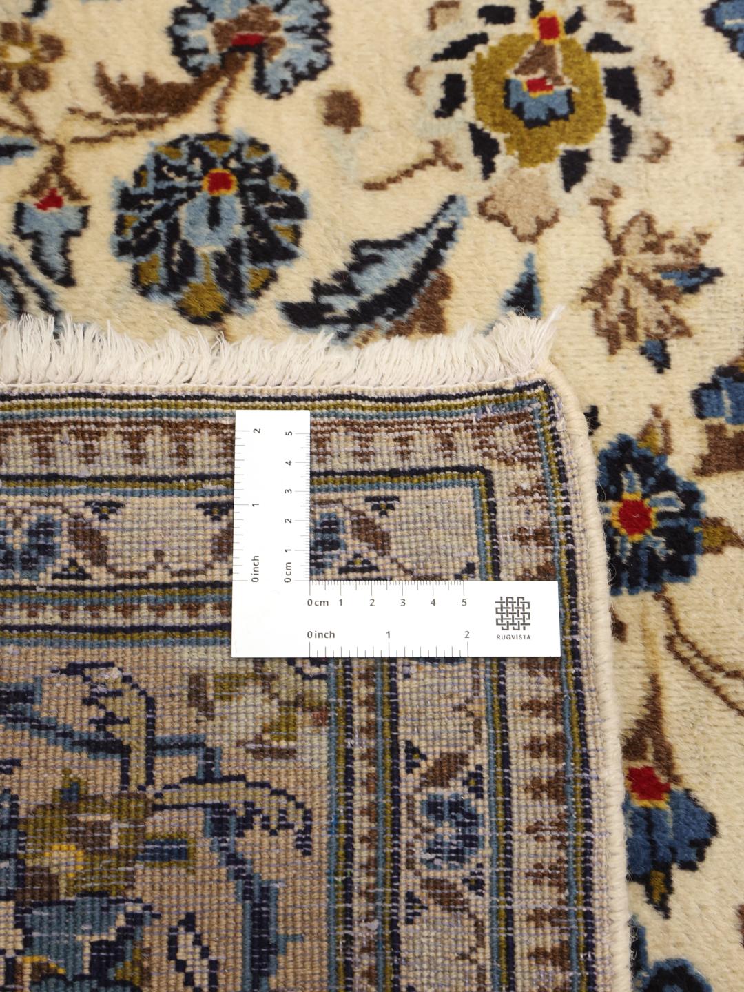 Hand-knotted Keshan rug from the Middle East with a beige and blue floral medallion pattern