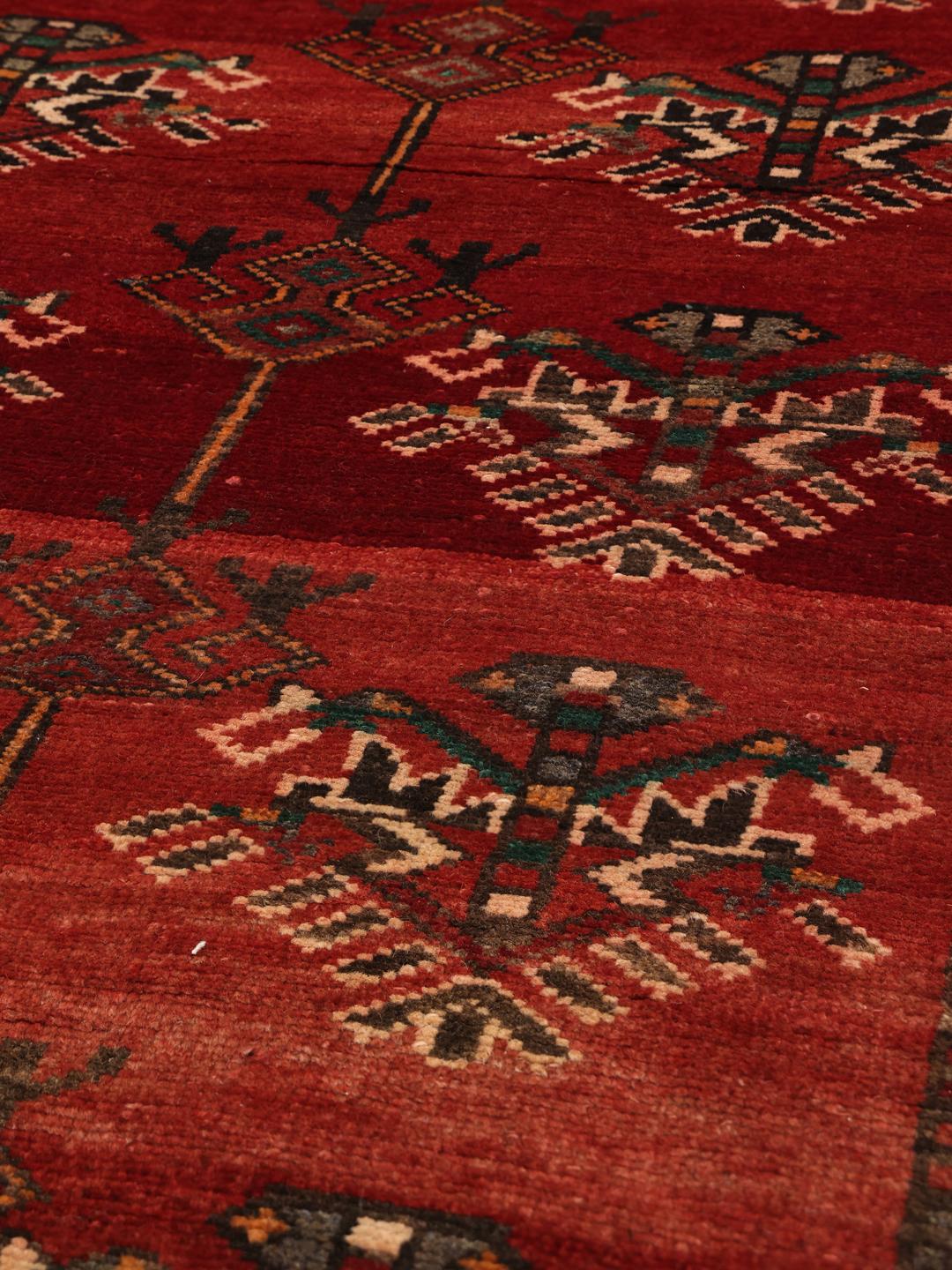 Hand-knotted Shiraz runner in deep red with geometric tribal motifs