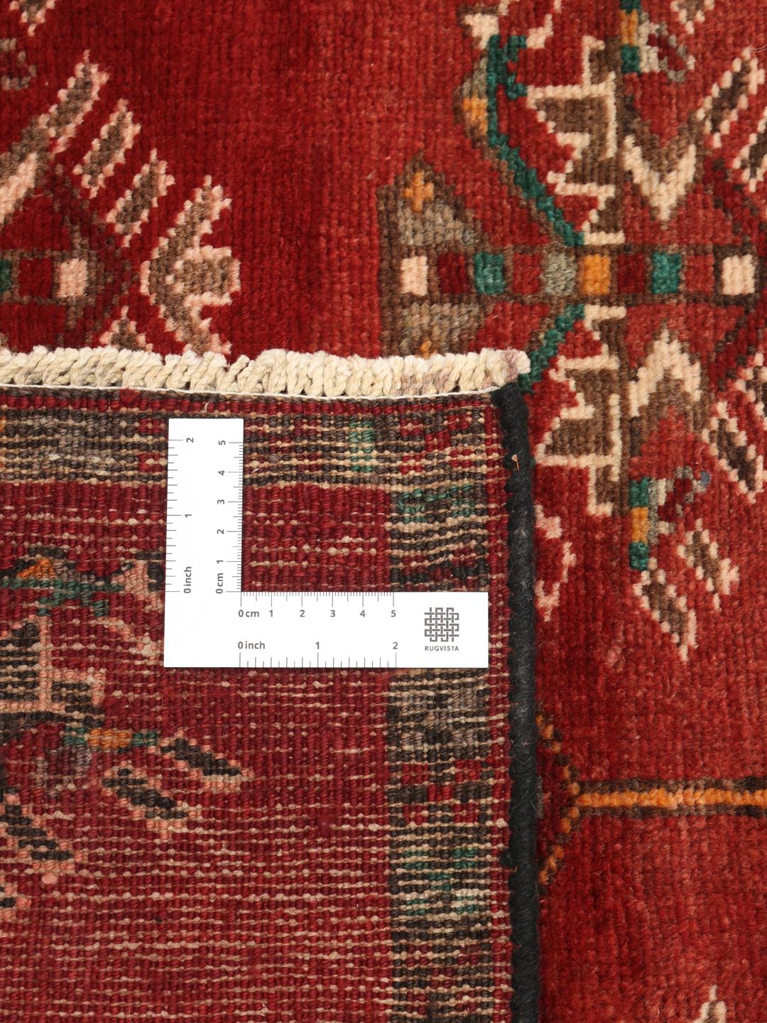 Hand-knotted Shiraz runner in deep red with geometric tribal motifs