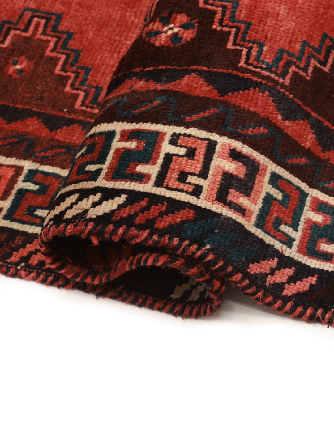 Hand-knotted Shiraz rug from the Middle East in vibrant red with geometric patterns