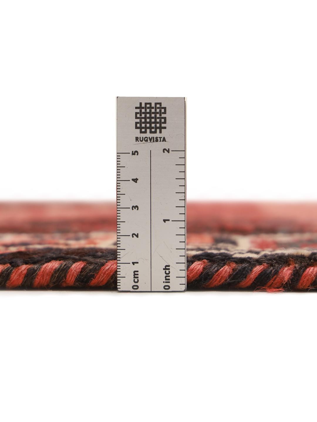 Hand-knotted Shiraz rug from the Middle East in vibrant red with geometric patterns