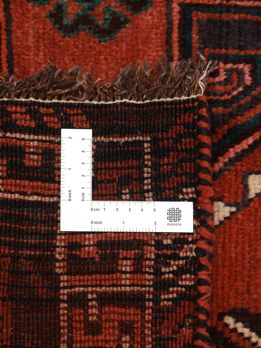 Hand-knotted Shiraz rug from the Middle East in vibrant red with geometric patterns
