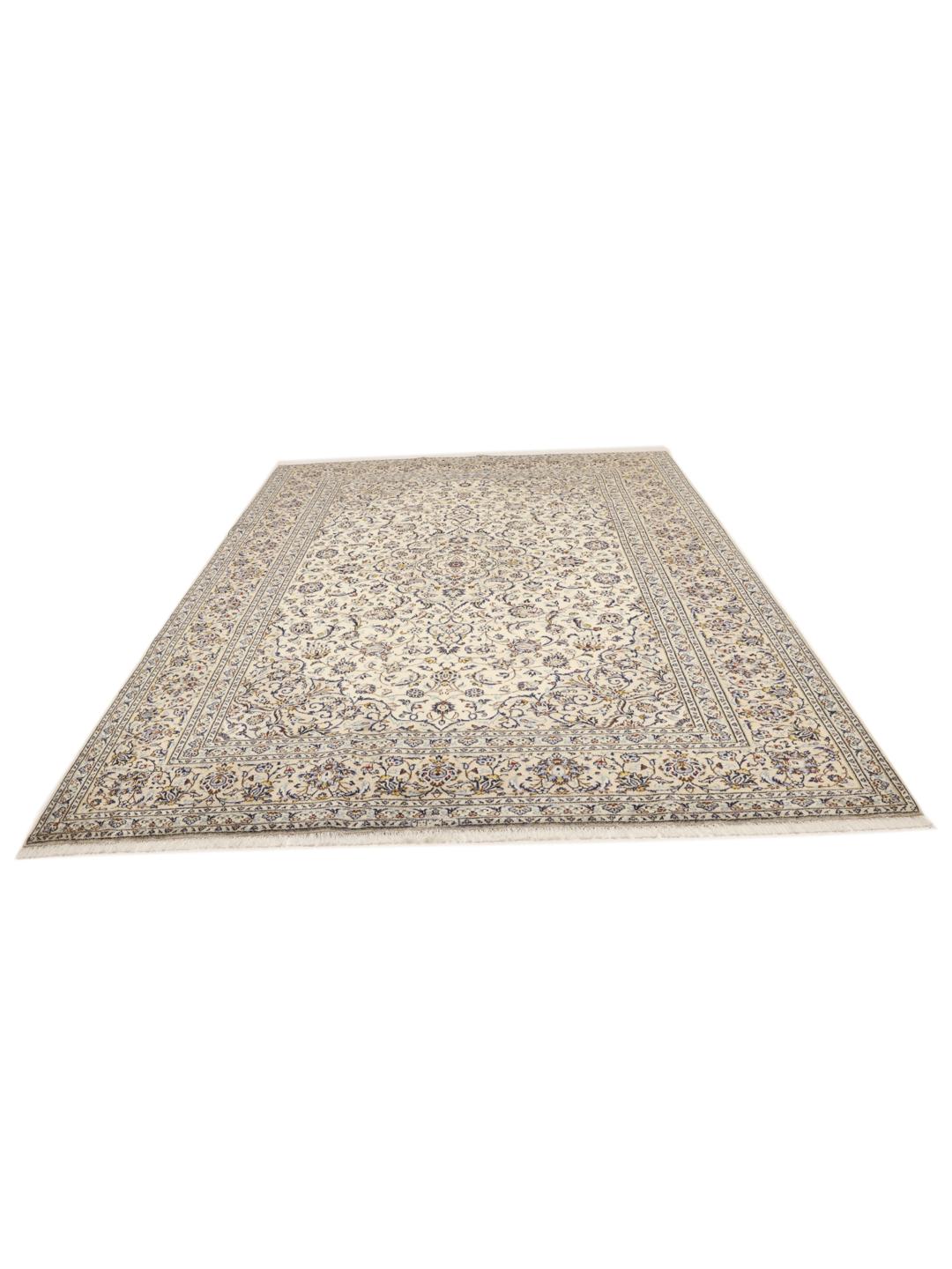 A hand-knotted Keshan rug from the Middle East with a cream background and floral motifs.