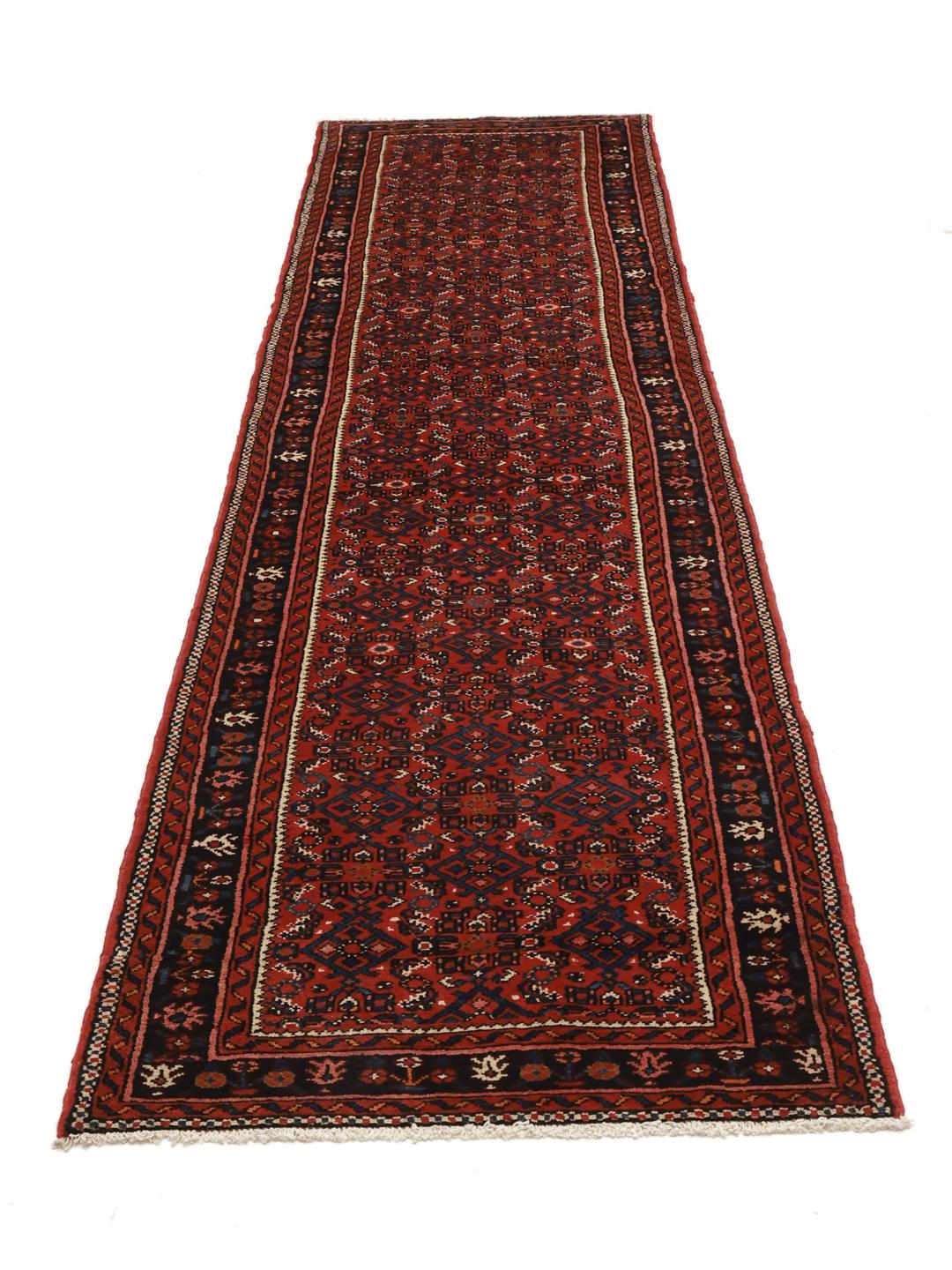 Hand-knotted Hosseinabad runner with traditional Middle Eastern motifs in red and dark blue