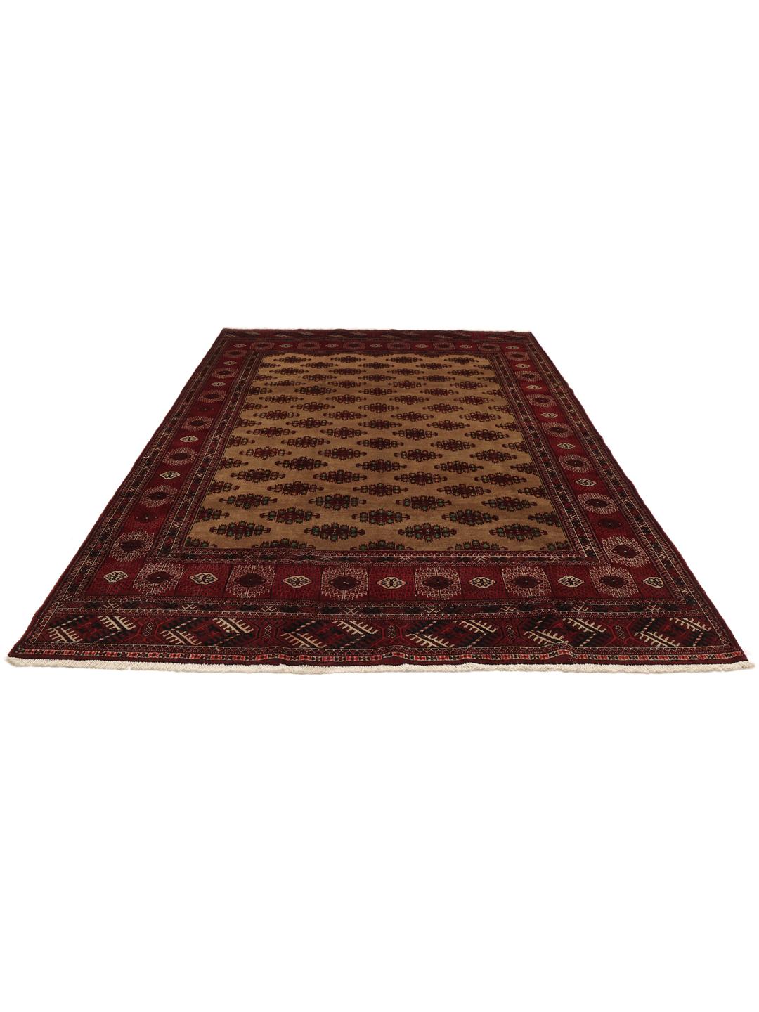 Hand-knotted Turkaman rug from the Middle East in deep red and beige tones.