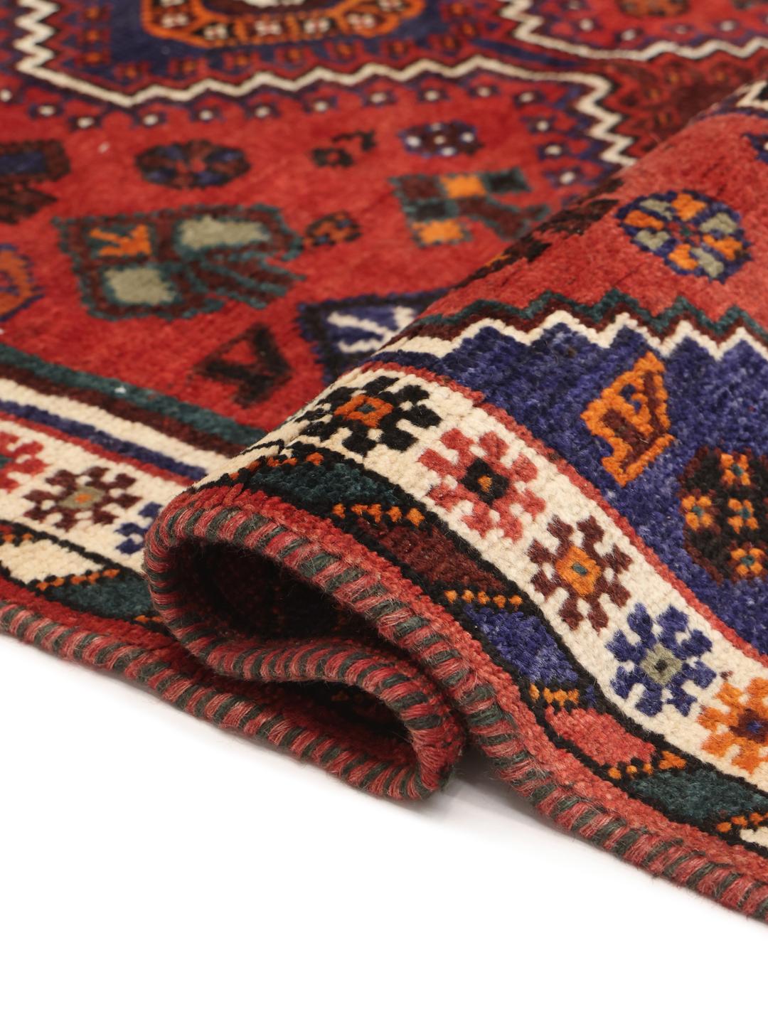 Hand-knotted Shiraz rug from the Middle East in red and blue