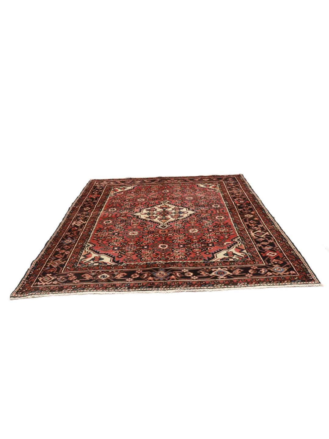 Hand-knotted Middle Eastern Hosseinabad rug in red and dark-blue tones.