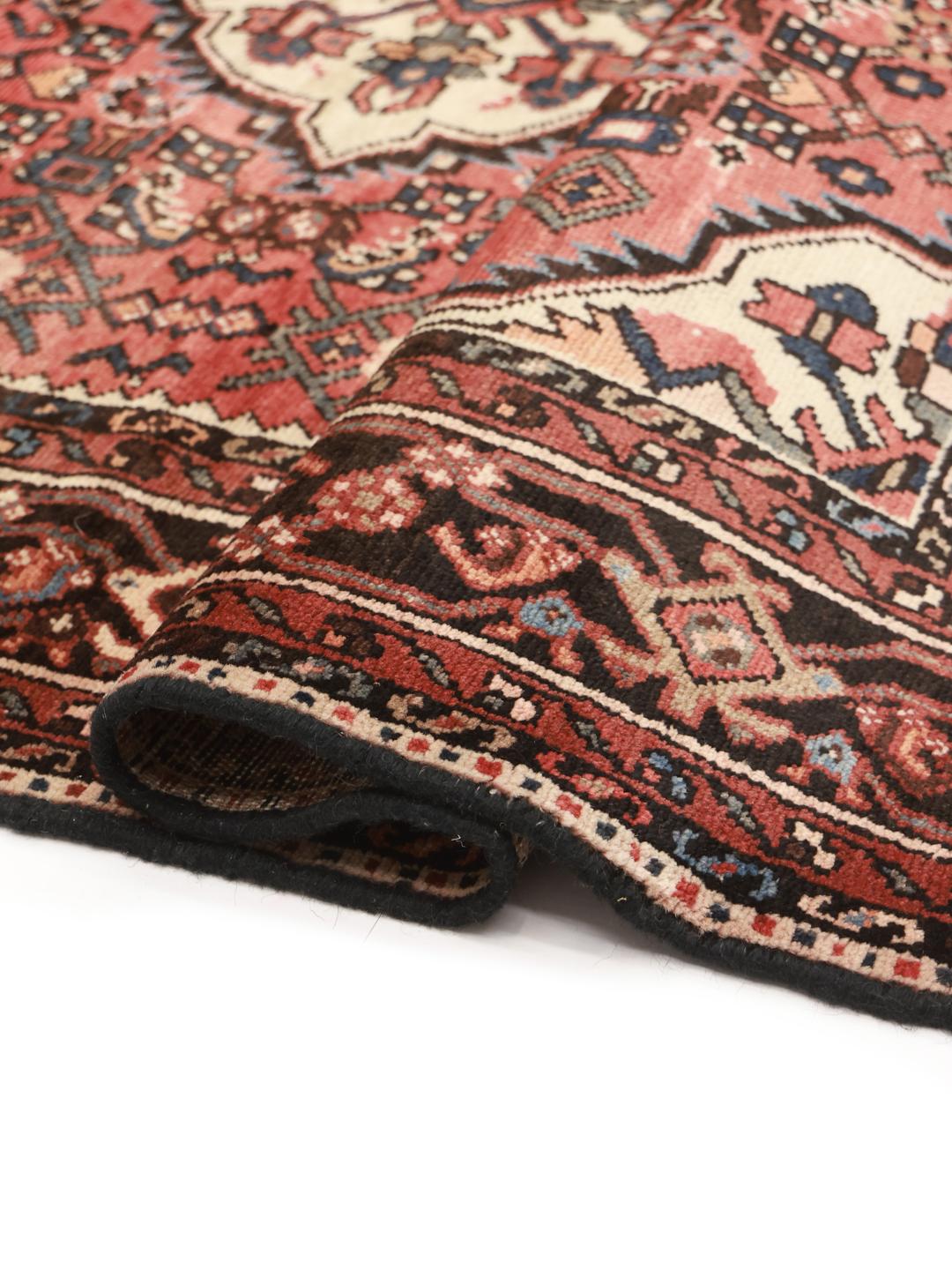 Hand-knotted Middle Eastern Hosseinabad rug in red and dark-blue tones.