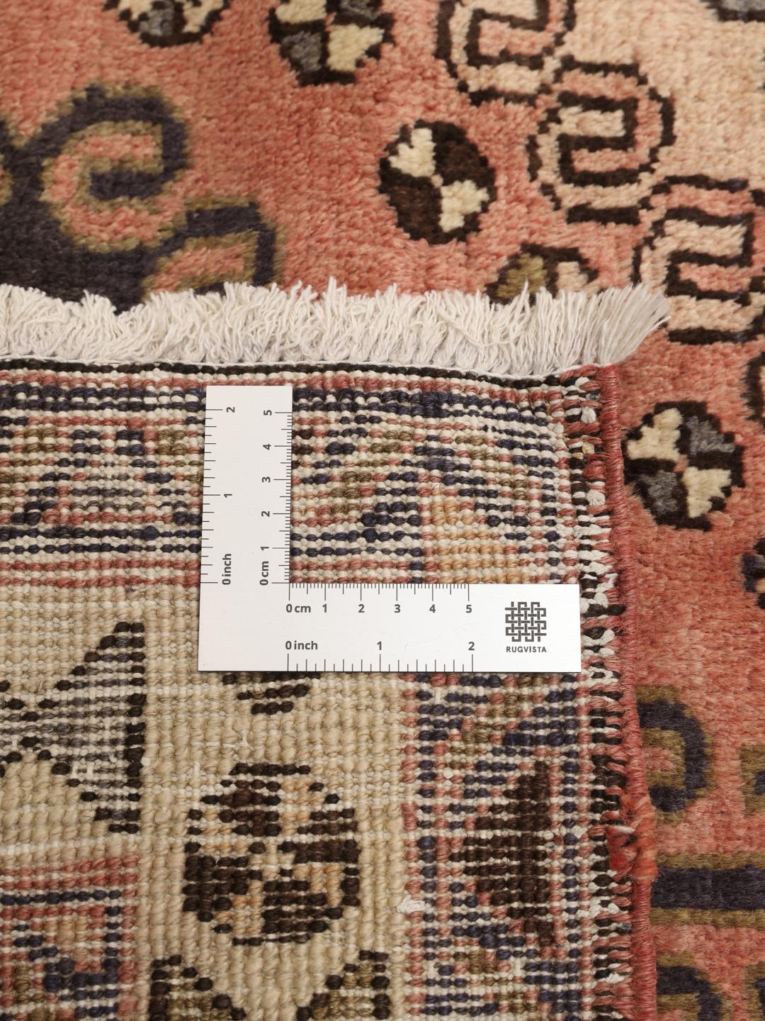 Håndknyttet løber fra Mellemøsten i røde og blå toner med geometriske mønstre
