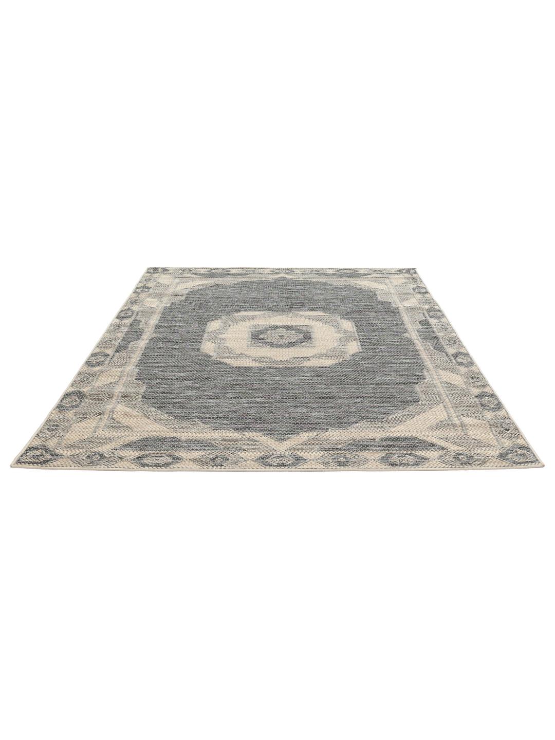 Donkergrijze en beige deurmat met een gedecoreerde rand