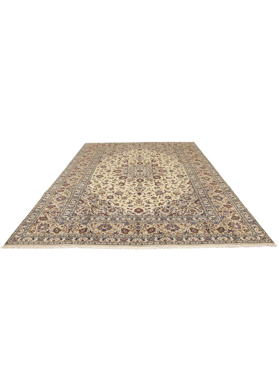 A large rectangular Keshan rug with a beige field and intricate floral medallion from the Middle East.