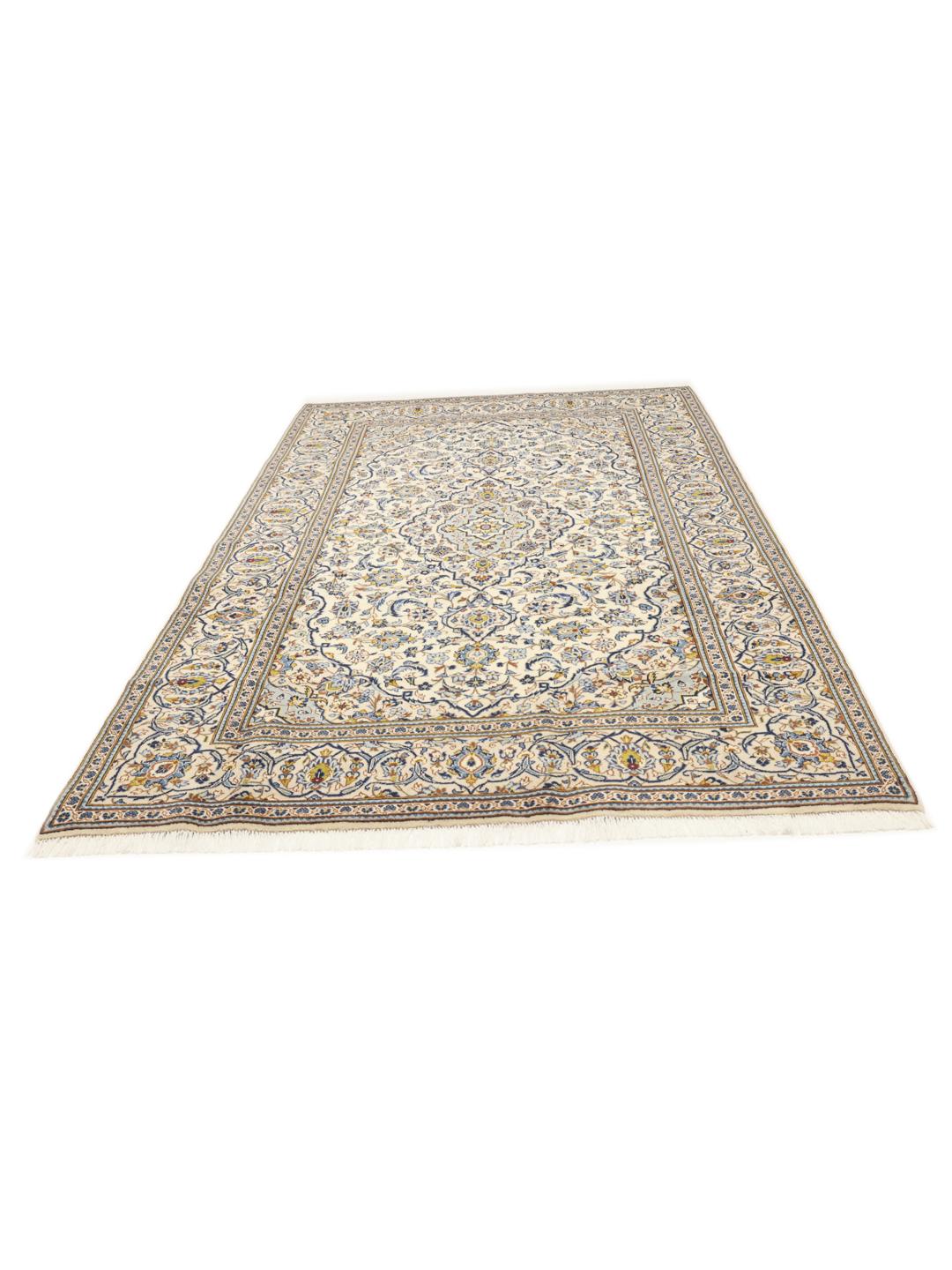Hand-knotted Keshan rug from the Middle East with a floral pattern in blue and beige.