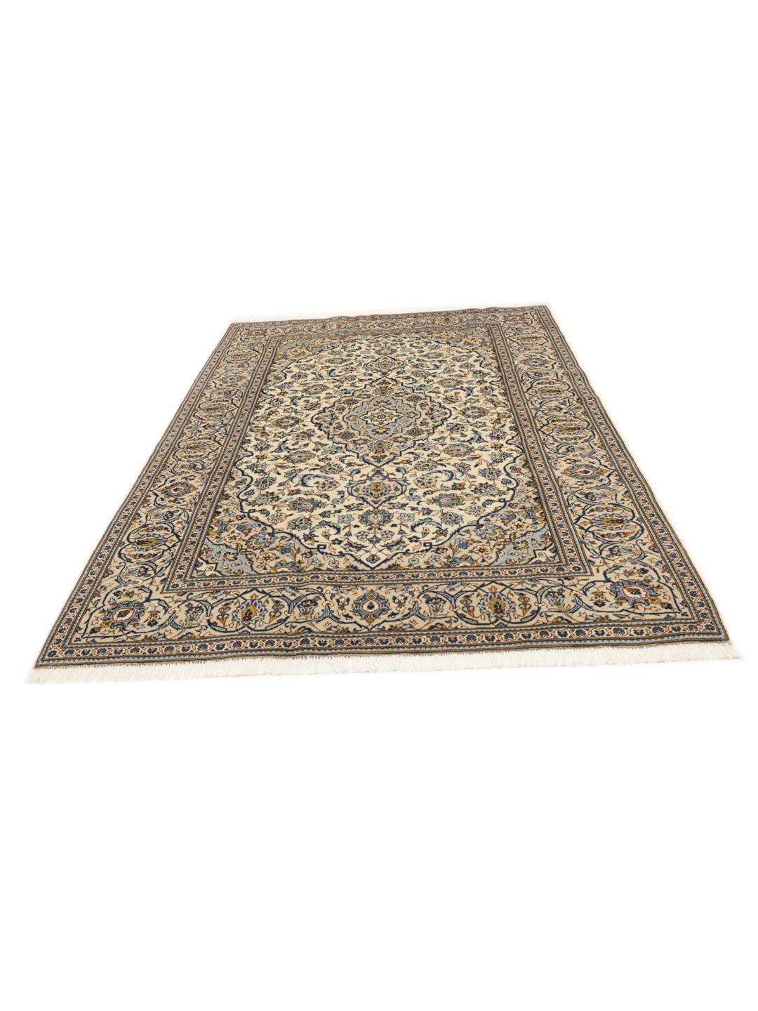 Hand-knotted Keshan rug from the Middle East with a floral pattern in blue and beige.