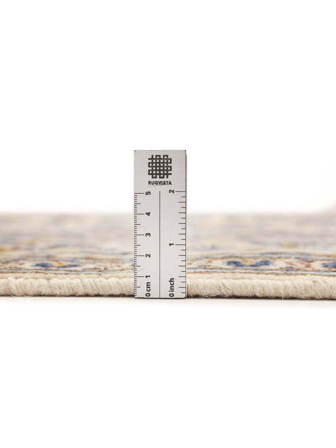 Hand-knotted Keshan rug from the Middle East with a floral pattern in blue and beige.