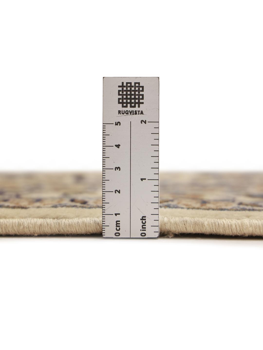 Hand-knotted Keshan rug from the Middle East in beige, blue, and orange tones.
