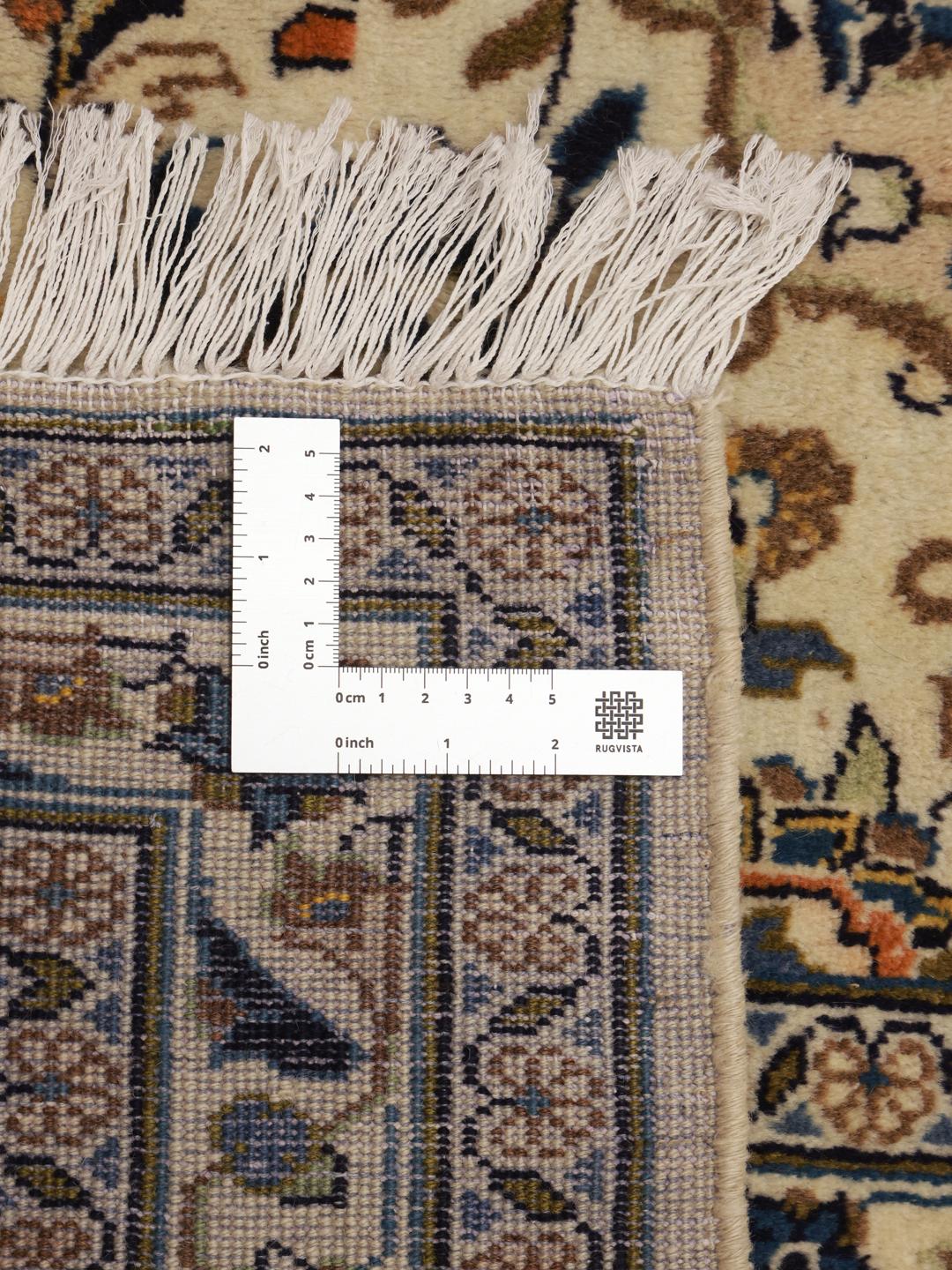 Hand-knotted Keshan rug from the Middle East in beige, blue, and orange tones.