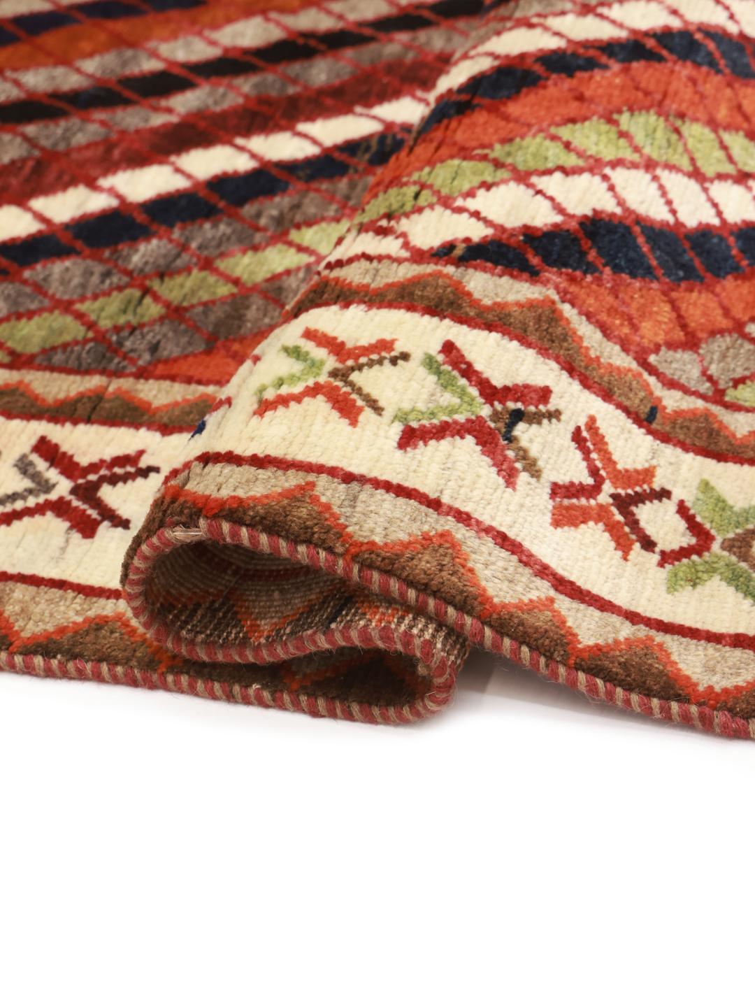 Hand-knotted Ghashghai rug from the Middle East with a multicolored diagonal lattice pattern