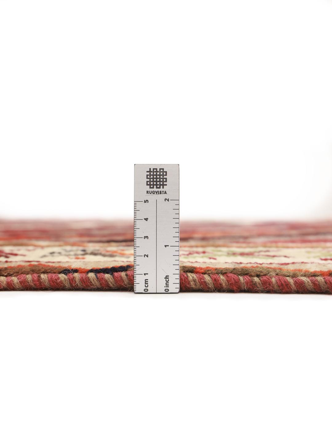 Hand-knotted Ghashghai rug from the Middle East with a multicolored diagonal lattice pattern