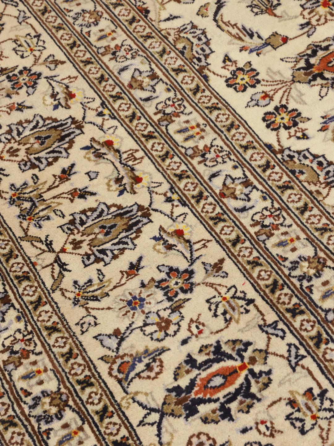 Hand-knotted Keshan rug from the Middle East with a floral pattern in beige and blue