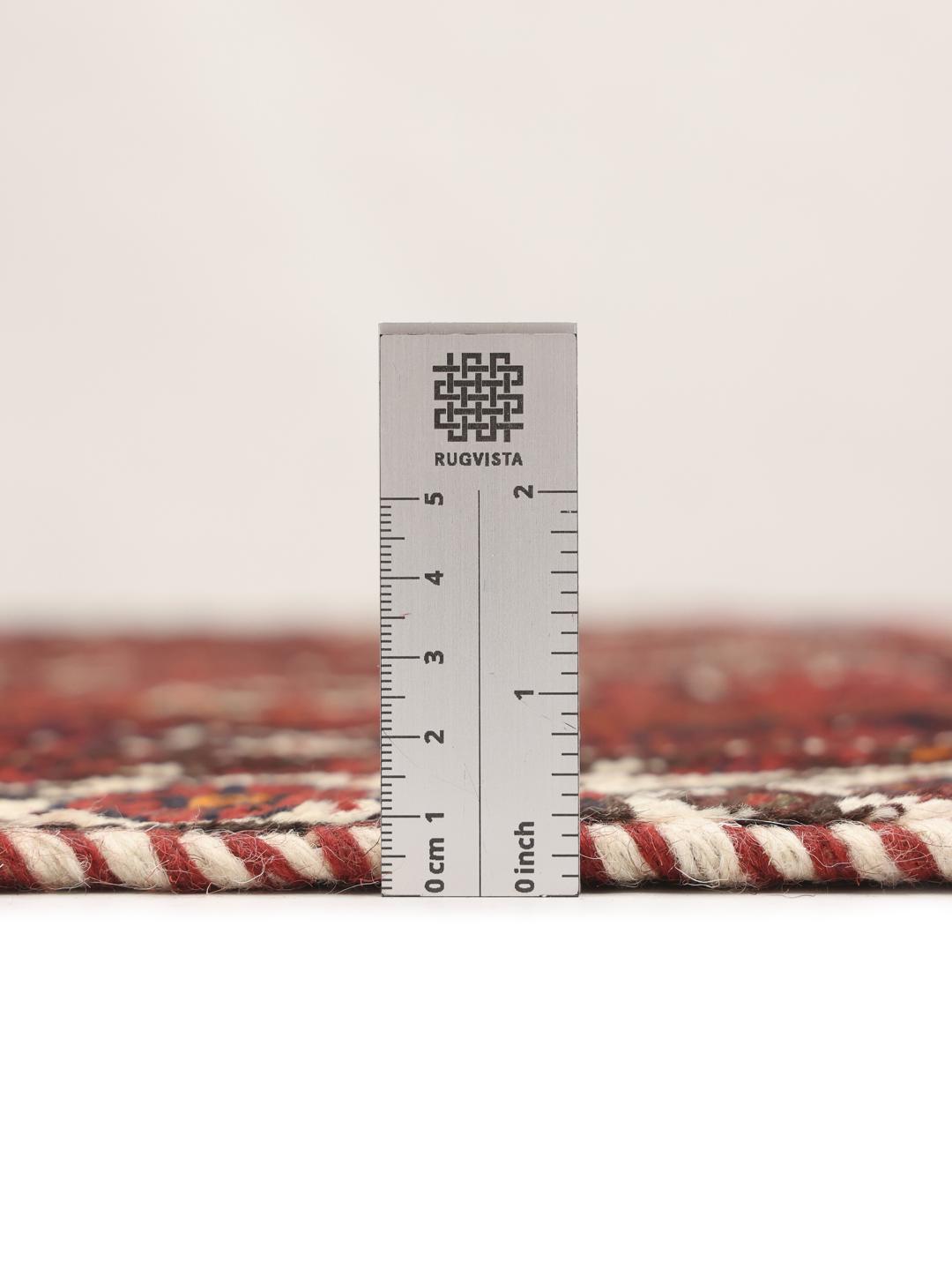 Hand-knotted Shiraz rug in dark red and black with tribal geometric patterns