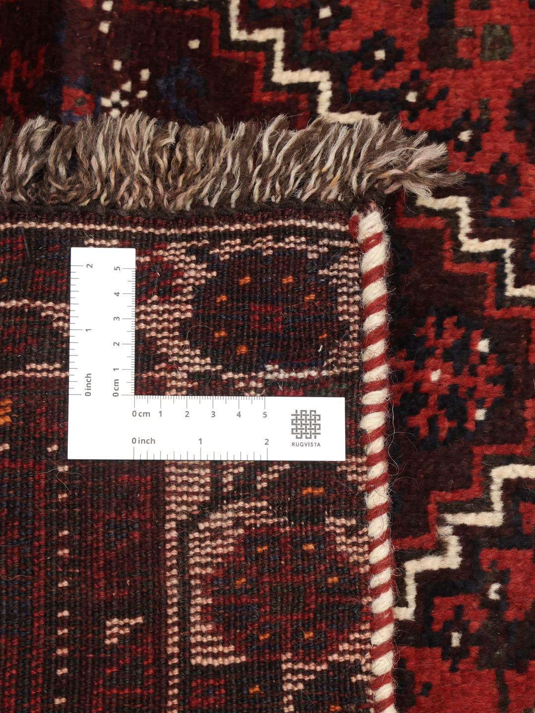 Hand-knotted Shiraz rug in dark red and black with tribal geometric patterns