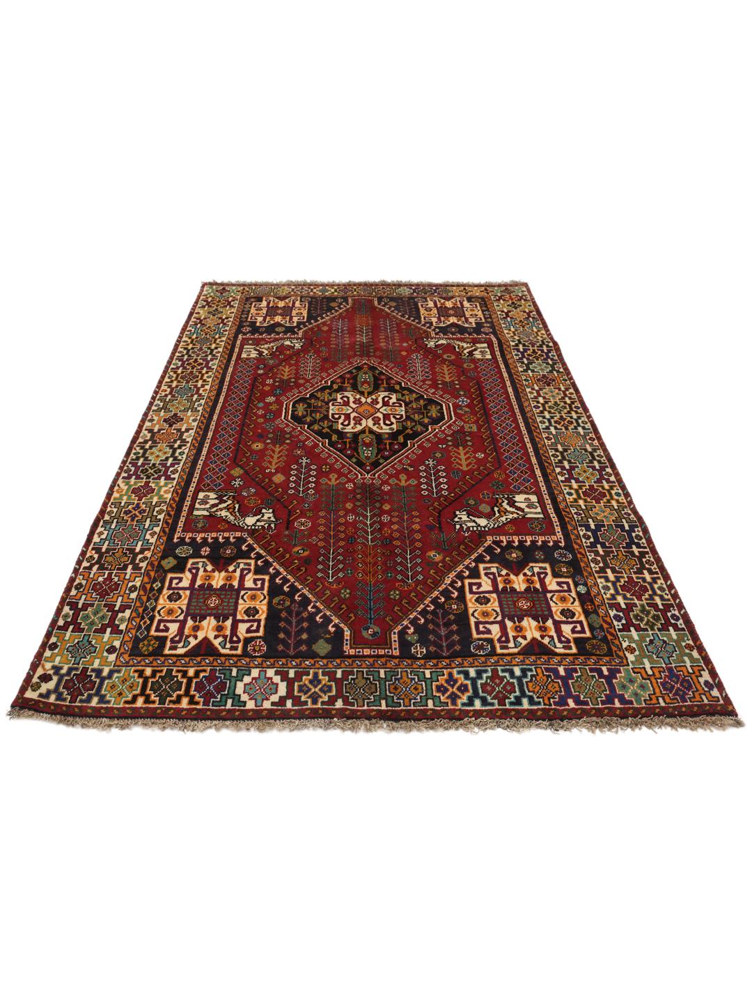 Hand-knotted Ghashghai rug from the Middle East with a red and dark-blue wool pile
