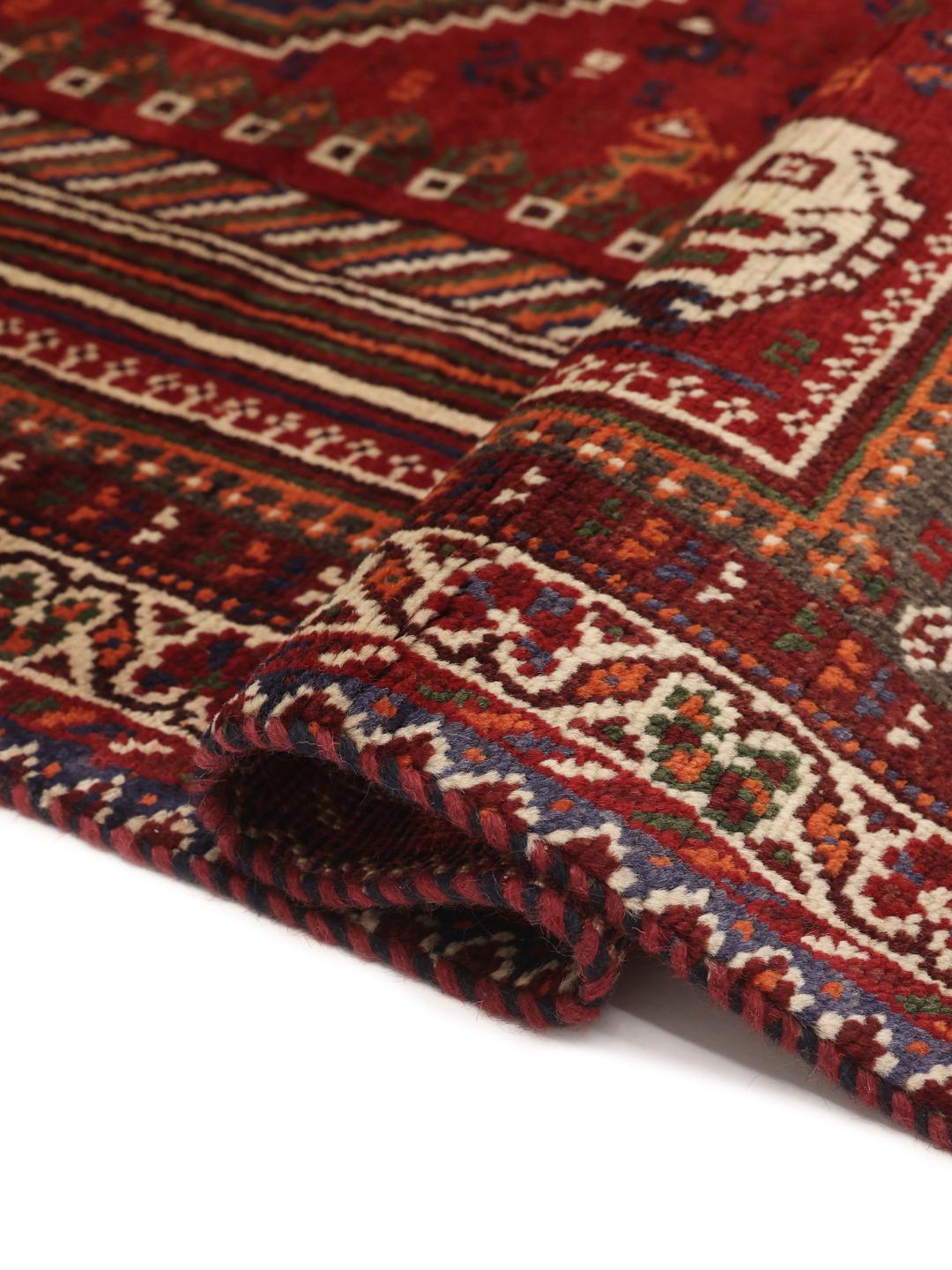 Hand-knotted Shiraz rug from the Middle East in deep red and blue tones