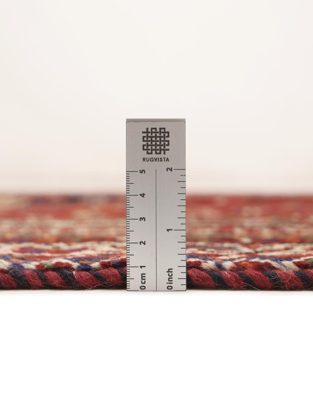 Hand-knotted Shiraz rug from the Middle East in deep red and blue tones