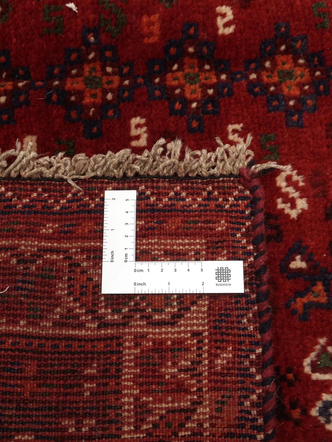 Hand-knotted Shiraz rug from the Middle East in deep red and blue tones