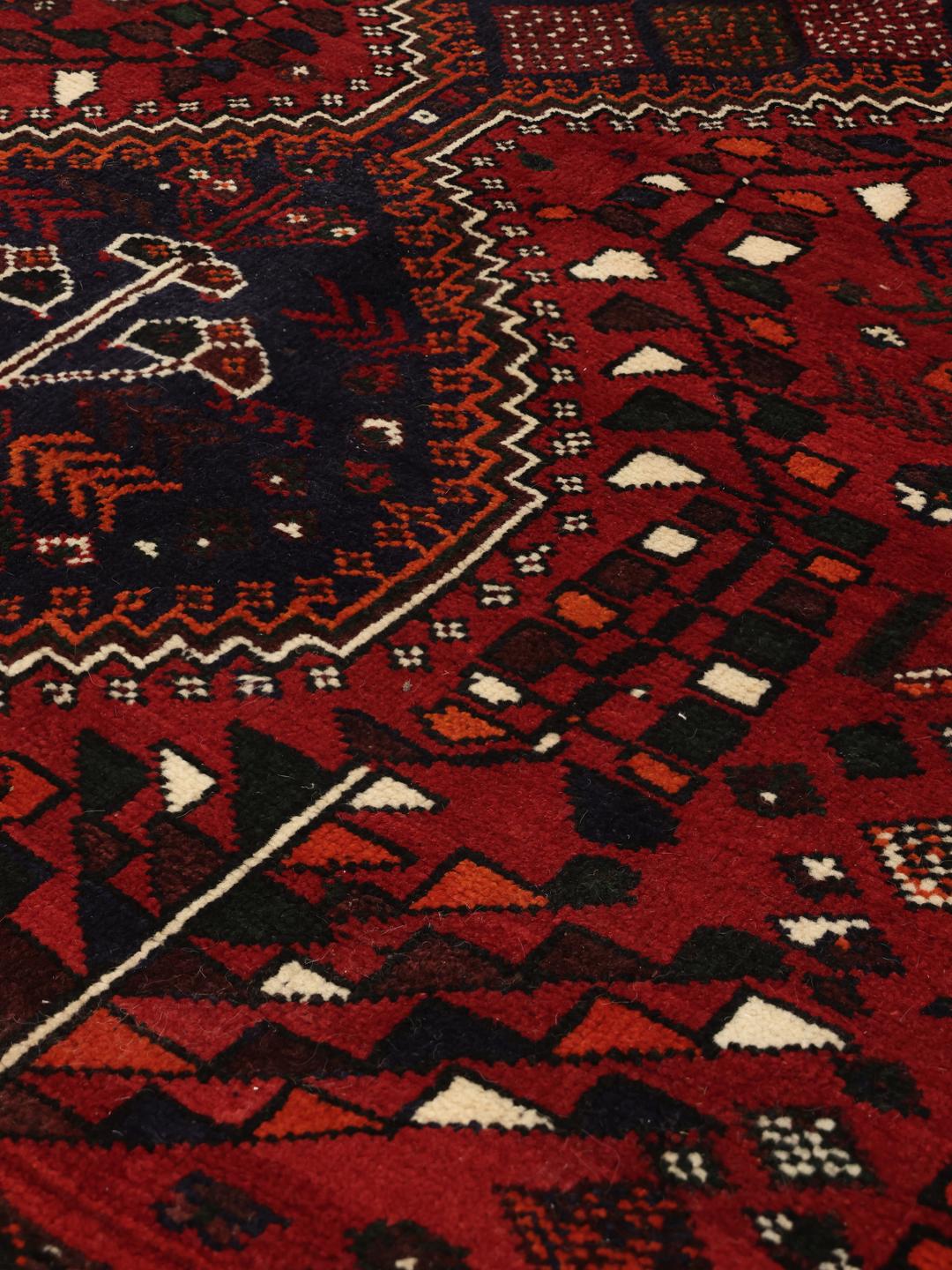 Hand-knotted Middle Eastern rug in dark red and dark blue