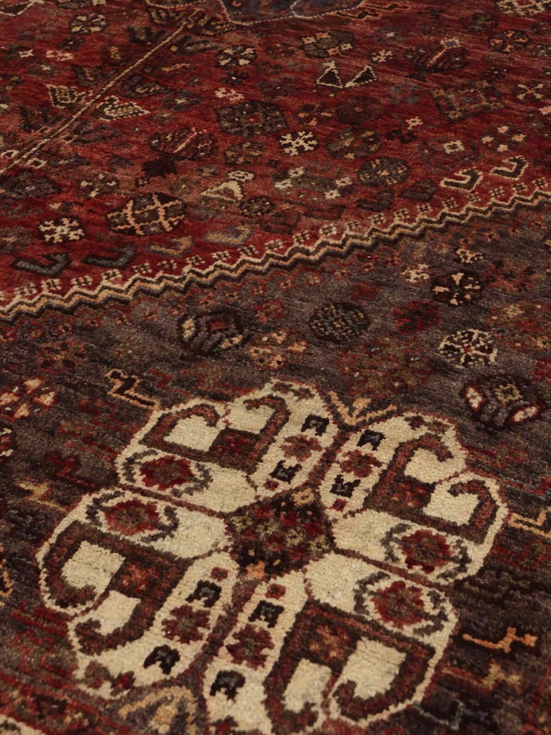 Hand-knotted Middle Eastern Shiraz rug in dark-red and blue tones