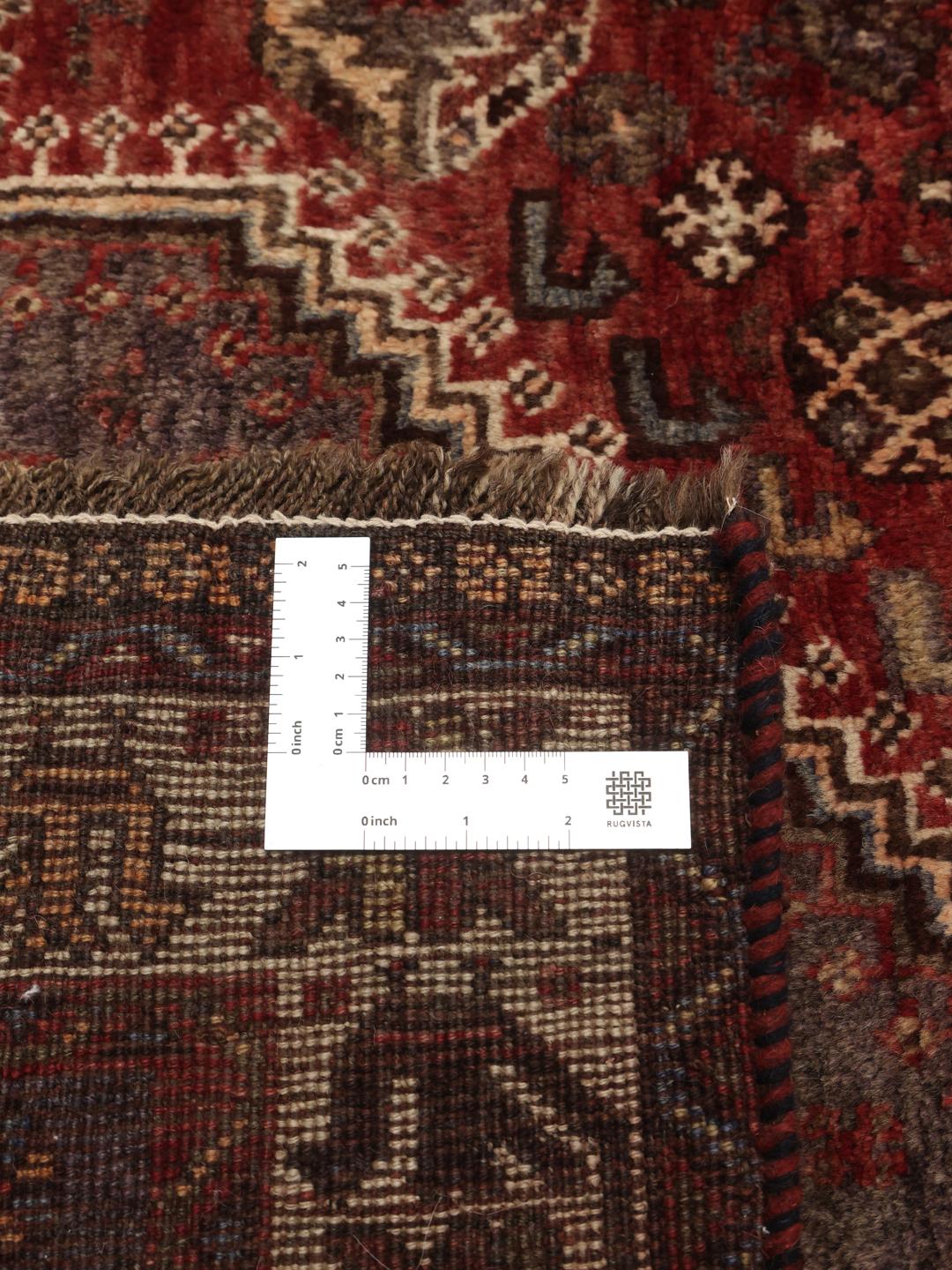 Hand-knotted Middle Eastern Shiraz rug in dark-red and blue tones