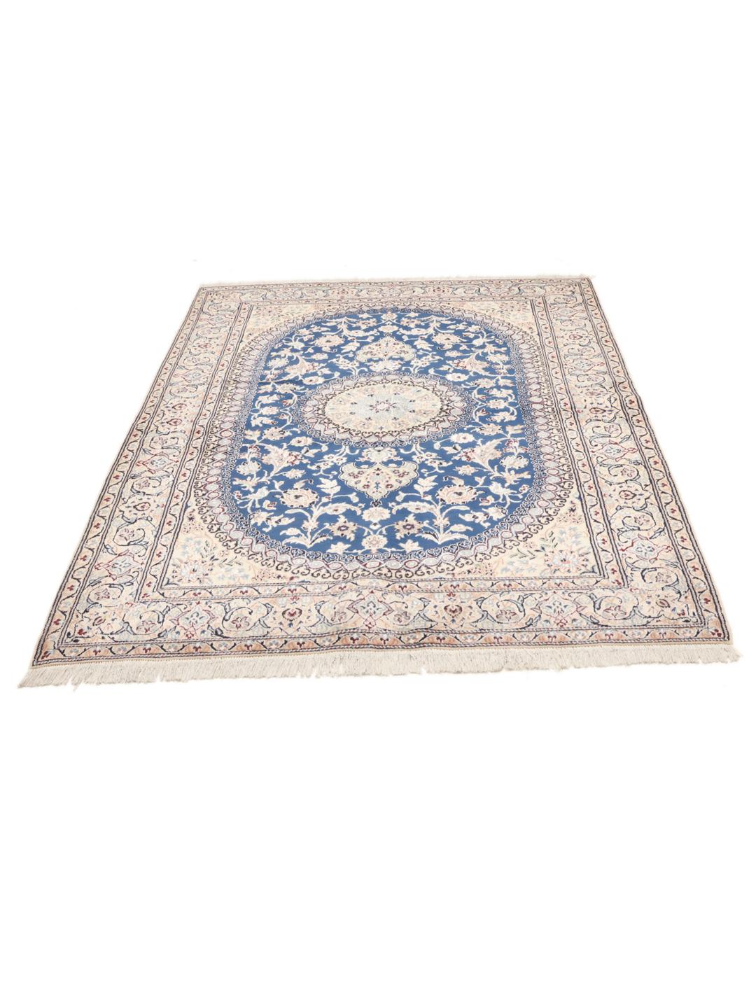 Hand-knotted Nain rug with a deep blue medallion and cream background from the Middle East
