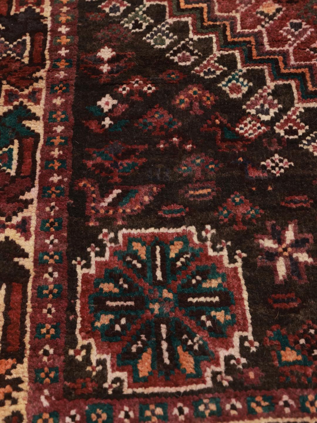 Hand-knotted Shiraz rug from the Middle East in dark-red and multicolour