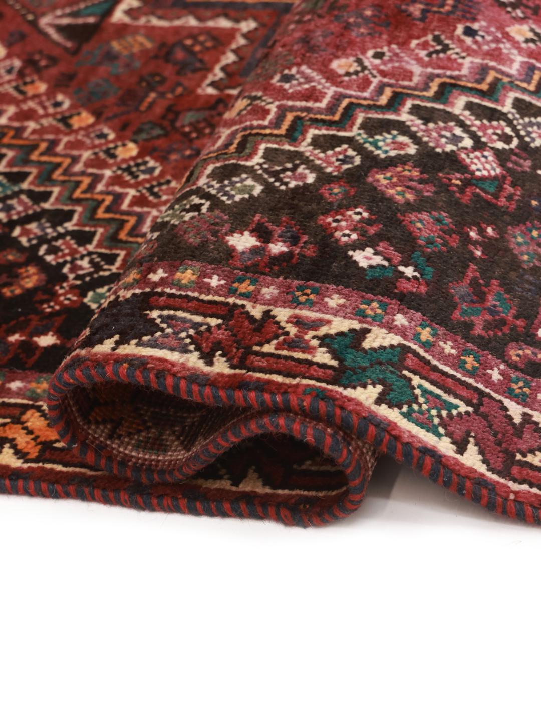 Hand-knotted Shiraz rug from the Middle East in dark-red and multicolour