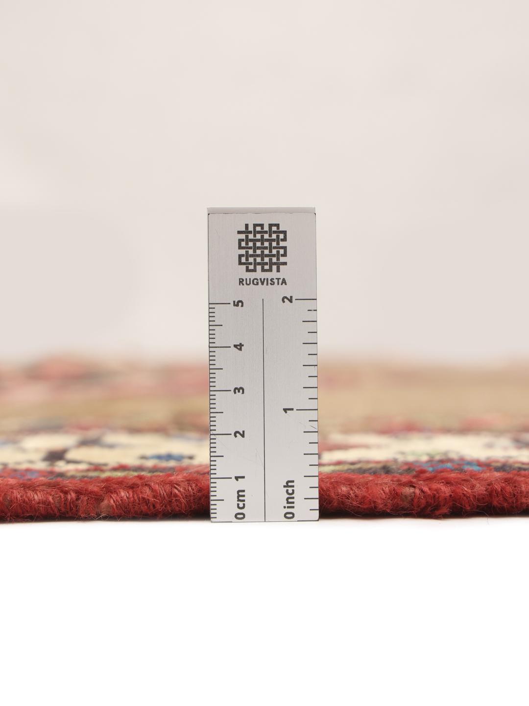 Hand-knotted wool rug from the Middle East in warm brown and red tones