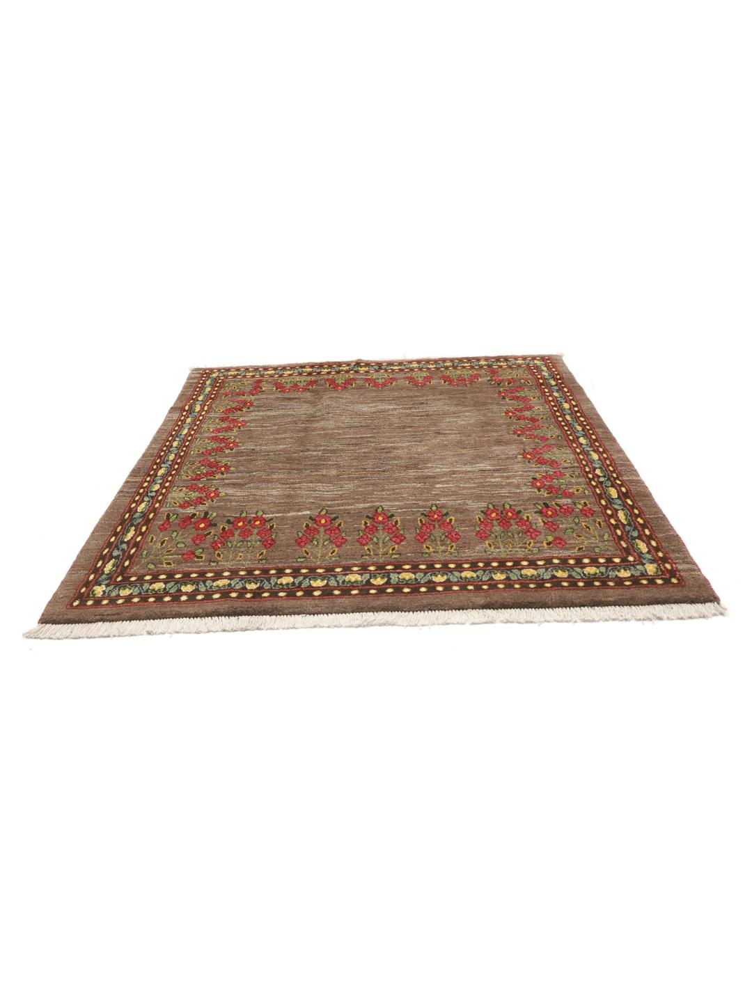 Hand-knotted Loribaft rug from the Middle East featuring floral patterns on a brown background.