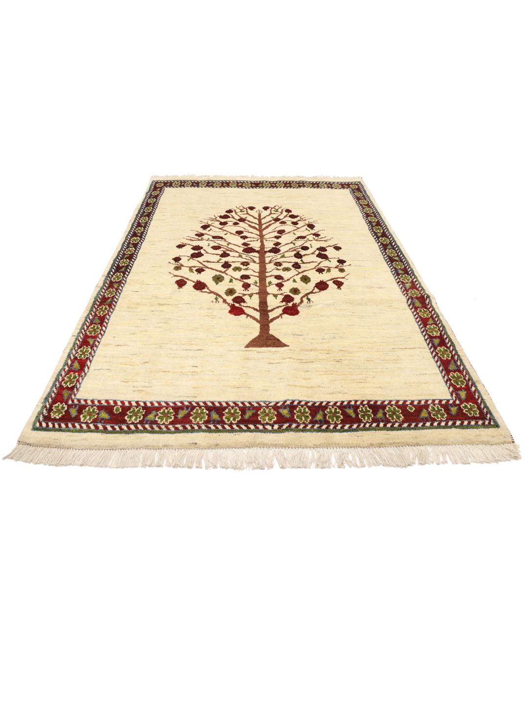 Handgeknoopt Loribaft-tapijt met een levensboommotief in beige, rode en groene tinten.