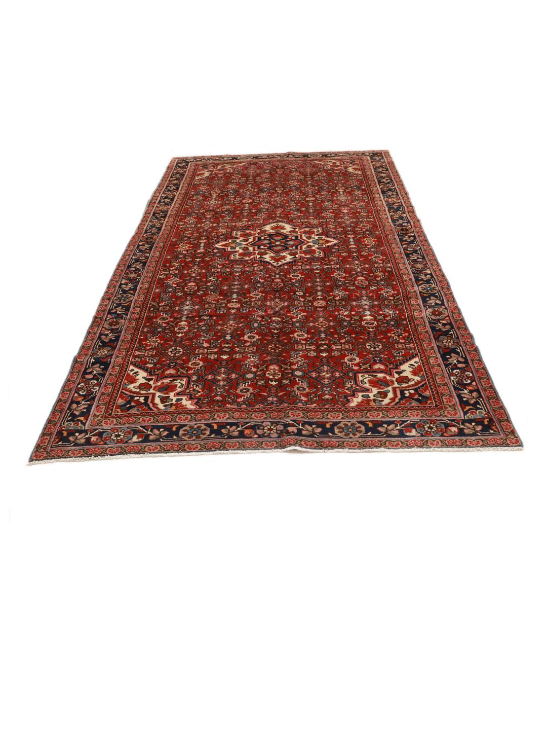 Hand-knotted Hosseinabad rug with a rich red field and decorative floral patterns