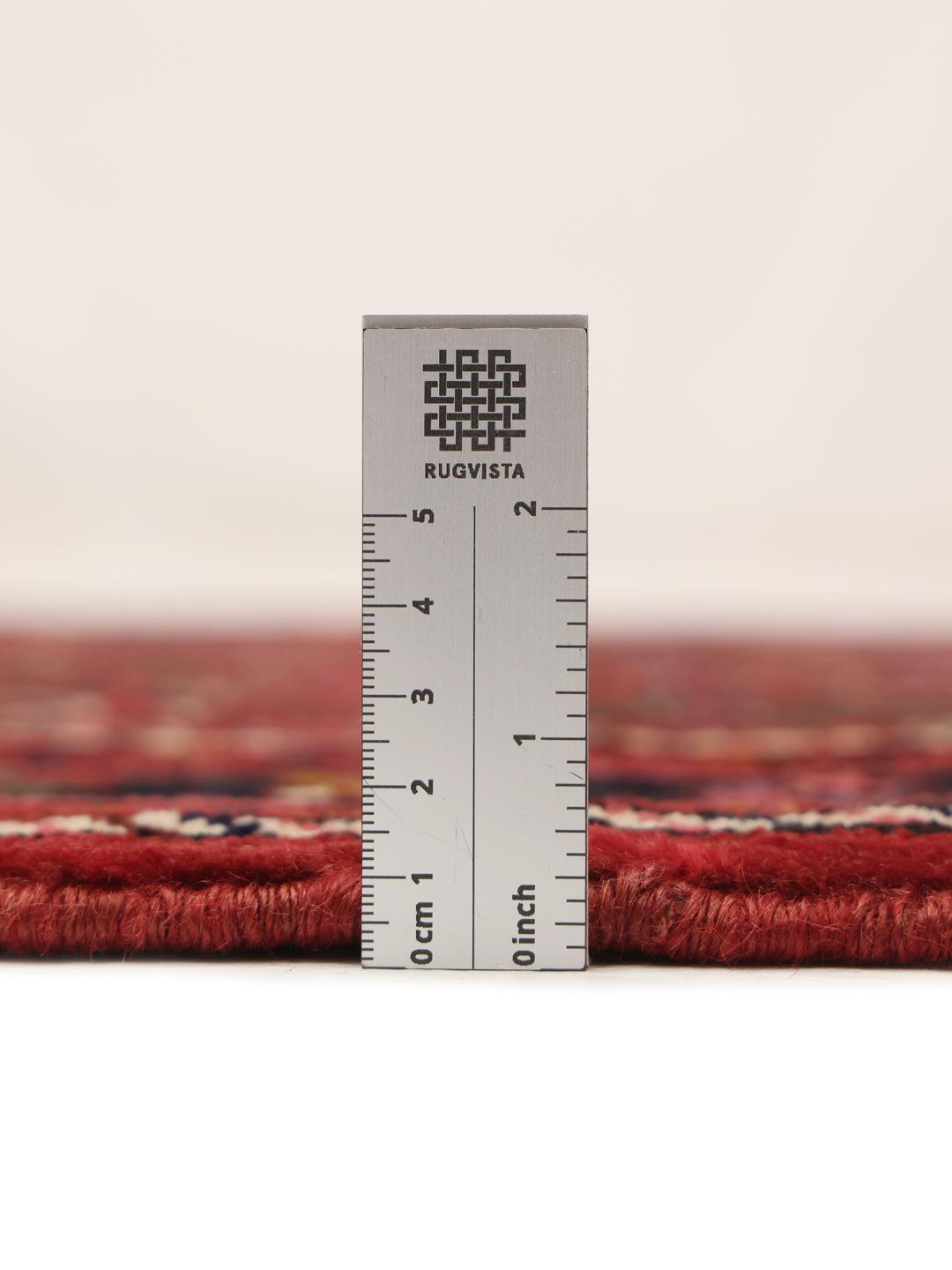 A long, hand-knotted Hosseinabad runner with a dark-red Wool pile and traditional Middle Eastern motifs.