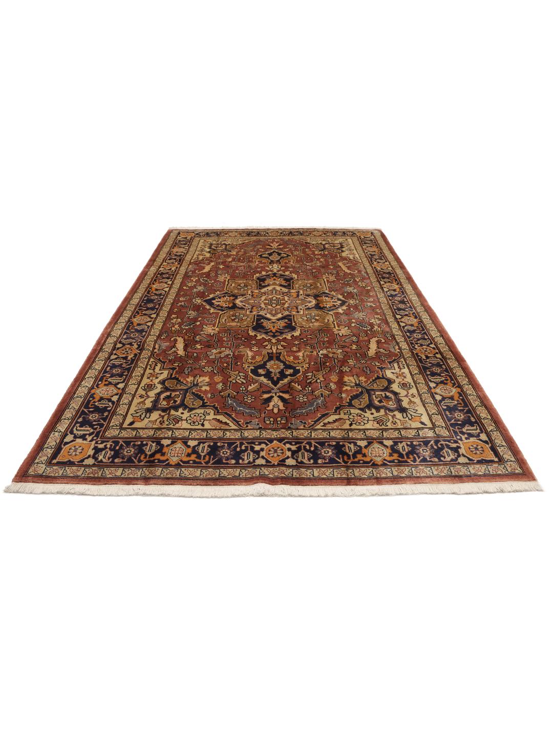 Hand-knotted Heriz rug from the Middle East in red and navy tones
