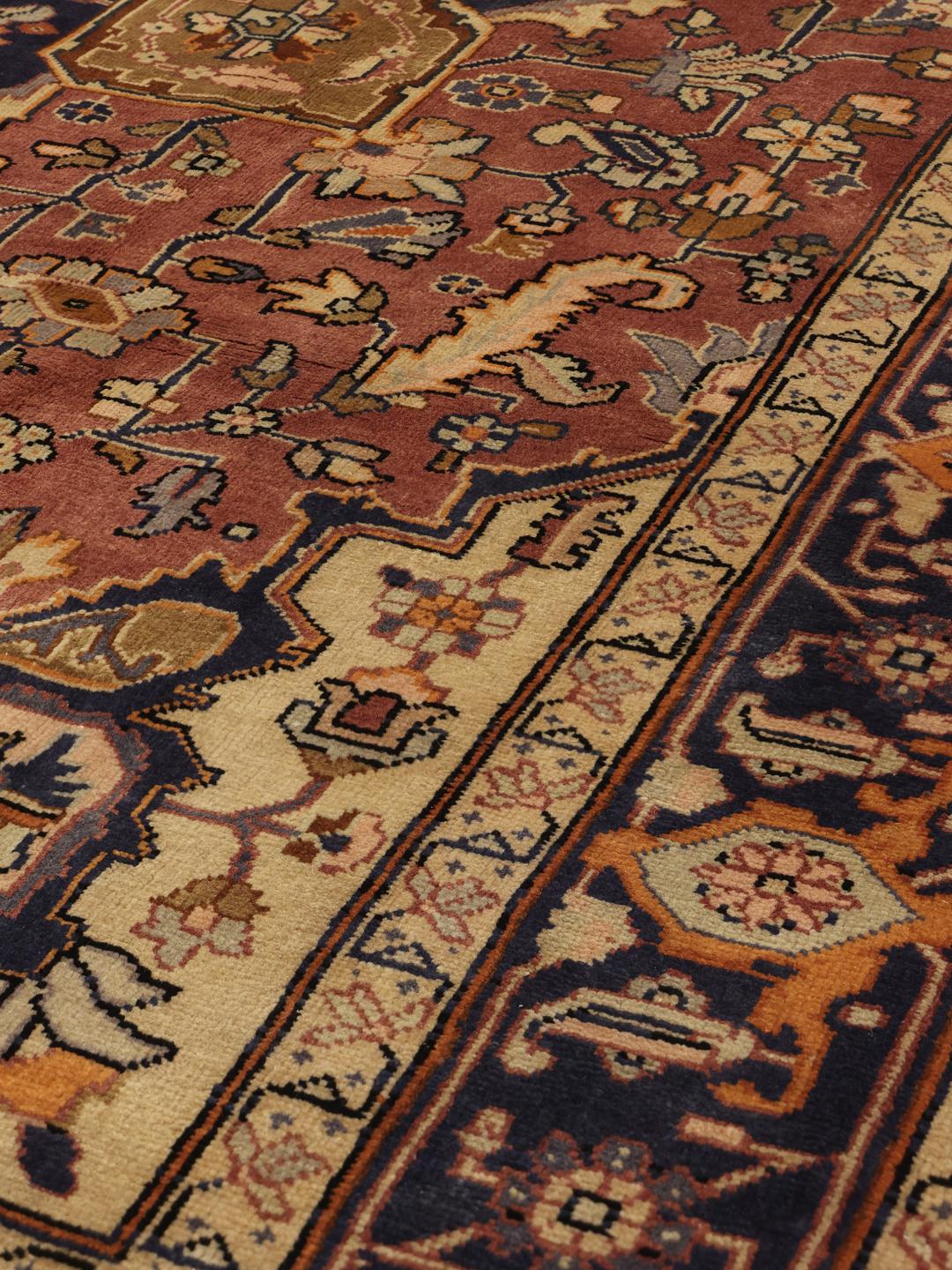 Hand-knotted Heriz rug from the Middle East in red and navy tones