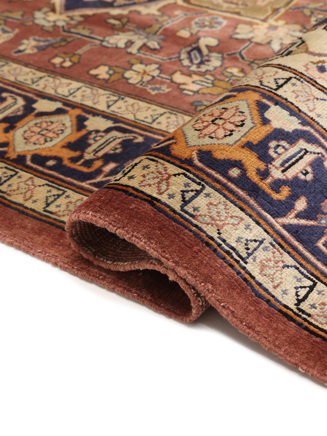 Hand-knotted Heriz rug from the Middle East in red and navy tones