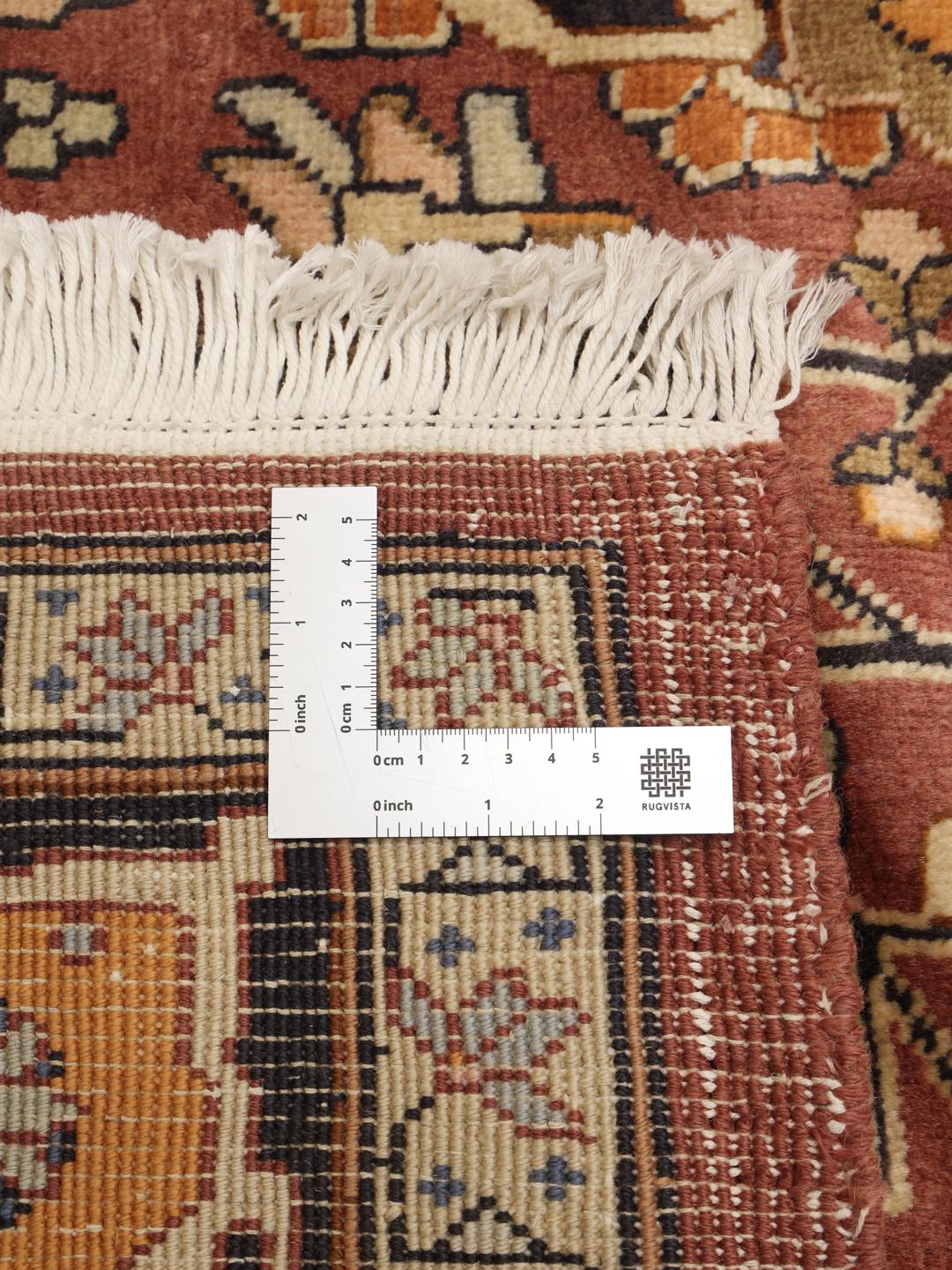 Hand-knotted Heriz rug from the Middle East in red and navy tones