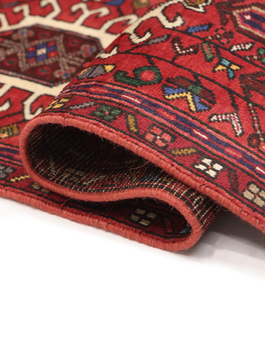 Hand-knotted Heriz runner from the Middle East in deep red tones