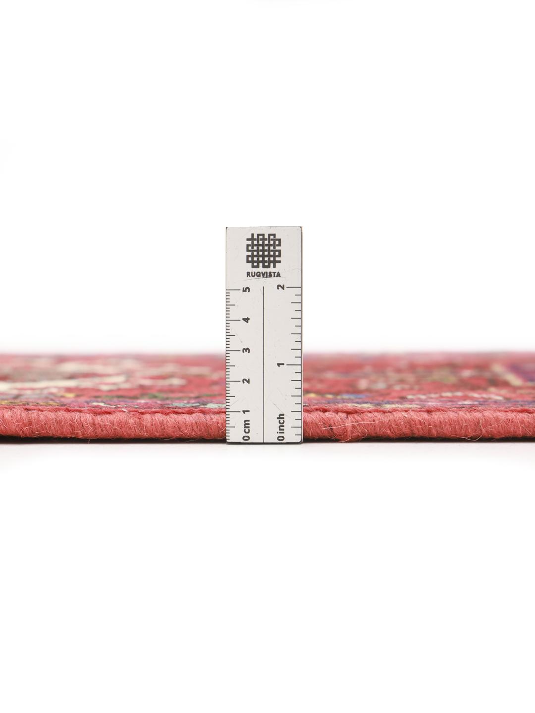 Hand-knotted Heriz runner from the Middle East in deep red tones
