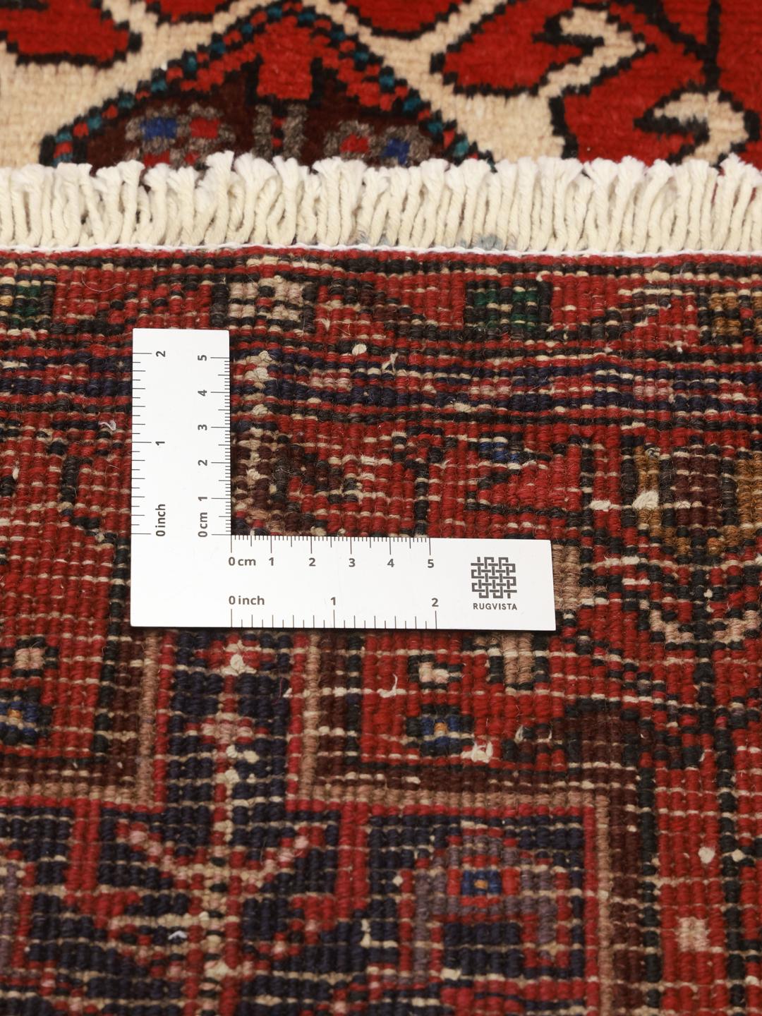 Hand-knotted Heriz runner from the Middle East in deep red tones