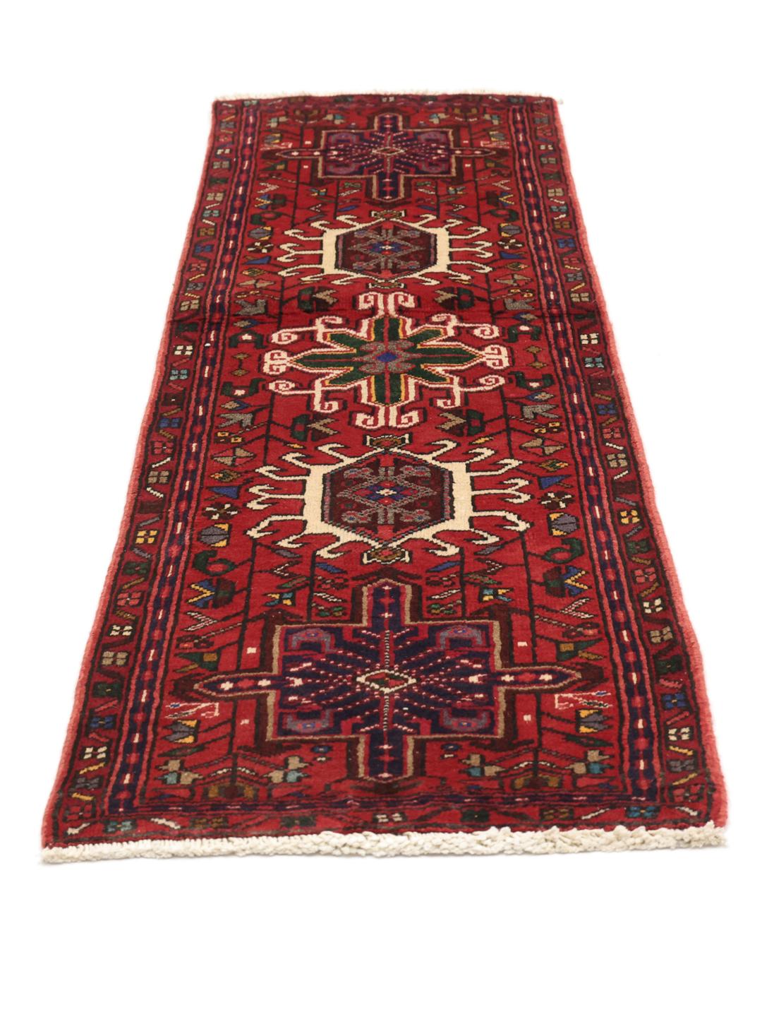Hand-knotted Heriz runner from the Middle East in deep red tones